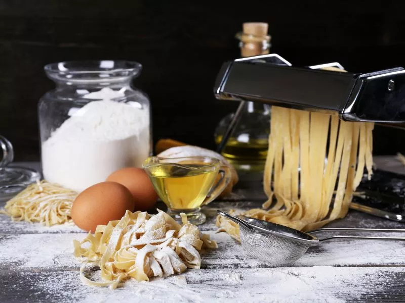 Pasta maker alongside ingredients