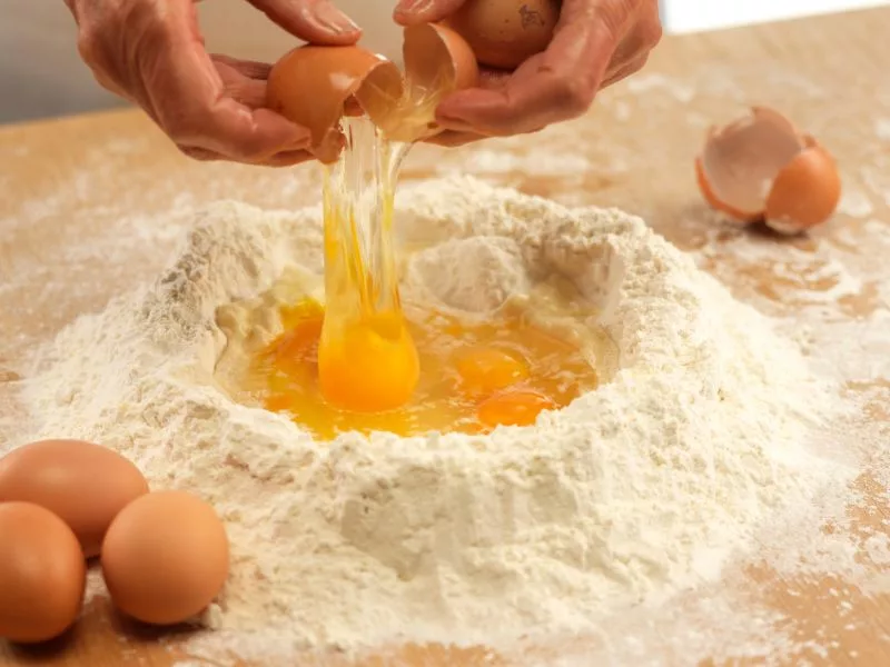 mixing flour and eggs for homemade pasta